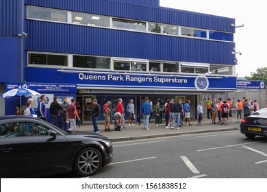 LONDON, ENGLAND - AUGUST 28, 2019: Football Fans In Front Of Queens Park Rangers Superstore At Kiyan Prince Foundation Stadium In London, England