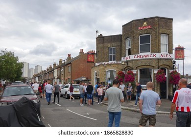 LONDON, ENGLAND - AUGUST 31, 2019: Football Fans On Braemar Road In Front Of The Griffin Pub In London, England