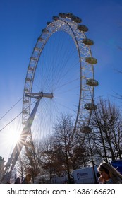 London, England - Dec 26th 2019: London Eye With Starburst Sun In Winter