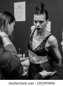 London. England February 2019 - Backstage A Model Dressing For A Designer Show At London Fashion Week AW19