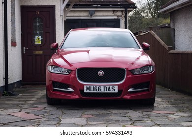 LONDON, ENGLAND - FEBRUARY 28, 2017: Red Jaguar Car Parked In A Driveway In London, UK, Front View.