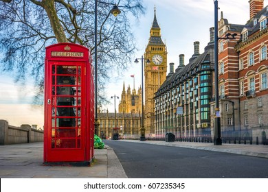 London, England - The iconic british old red telephone box with the Big Ben at background in the center of London