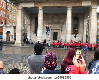 London, London / England - January 22 2020: Group Of School Children Watching A Unicyclist Street Performer Outside St Pauls Church In Covent Garden