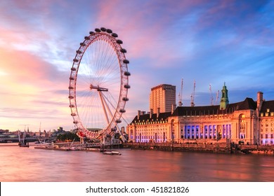 LONDON, ENGLAND - JULY 03,2016. View of City Of London at sunset with London Eye the biggest attraction in London.