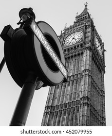 LONDON, ENGLAND - JULY 3, 2016: Underground Sigh Near Big Ben Clock Tower In Black And White 