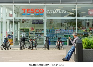 LONDON, ENGLAND - JULY 7, 2016: The exterior of an Tesco's express supermarket. Tesco's is one of the UK's leading supermarkets.