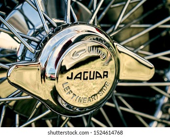 London, England - June 02, 2019: Detail of Jaguar E Type Wheel Spinner, a two door british made sports car produced between 1961 and 1975. 