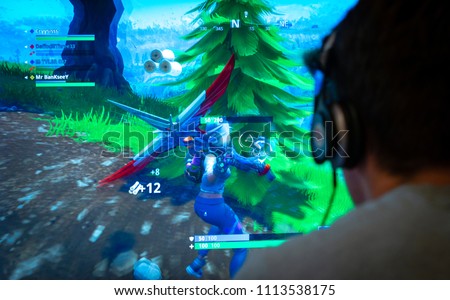 london england june 13 2018 teenager playing fortnite video game fortnite is a web based multi player survival game developed by epic games image - shutterstock fortnite