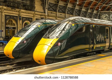 LONDON, ENGLAND - JUNE 2018: New electro diesel passenger inter city trains side by side at London Paddington Station. The trains are built by Hitachi and operated by Great Western Railway.