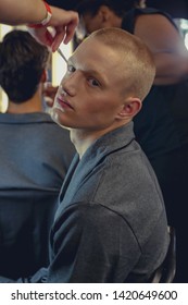 London, England - June 2019. London Fashion Week. Male Model Backstage With A Buzz Cut.