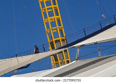 London, England - June 2022: Person Climbing The Roof Of The O2 Arena In London