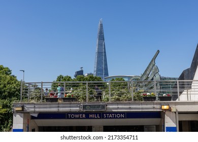 London, England - June 21 2022: Entrance To Tower Hill Metro Station With Viewing Platform With People On Top. Tall Building The Shard Visible In Background