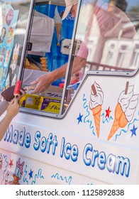 LONDON, ENGLAND - JUNE 30, 2018: Customer Buying Ice Cream And Handing Over Money To The Vendor Of An Ice Cream In London, England