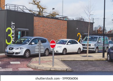 LONDON, ENGLAND - MARCH 1st, 2017: Cars At McDonald's Drive Thru, Harrow, UK.