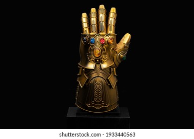 LONDON, ENGLAND - March 2021: Thanos's Infinity Gauntlet With Infinity Stones As Seen In The Avengers Infinity War And Endgame Movies Produced By Marvel Studios.