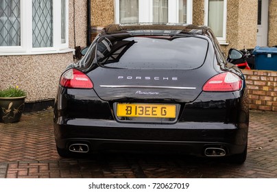 LONDON, ENGLAND - MARCH 3, 2017: Black Porsche Panamera Parked In A London, Residential Suburban Driveway.