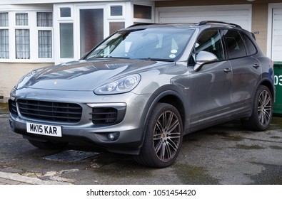 LONDON, ENGLAND - MARCH 6, 2017: Grey Porsche Cayenne Parked On A Driveway, London.