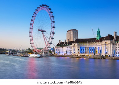 LONDON, ENGLAND - May 14, 2016 : The London Eye near the River Thames  in London at dusk, England. The London Eye is a giant Ferris wheel on the South Bank of the River Thames in London.