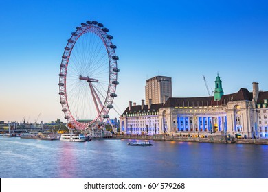 LONDON, ENGLAND - May 14, 2016 : The London Eye near the River Thames at dusk, England. The London Eye is a giant Ferris wheel on the South Bank of the River Thames in the capital of UK.