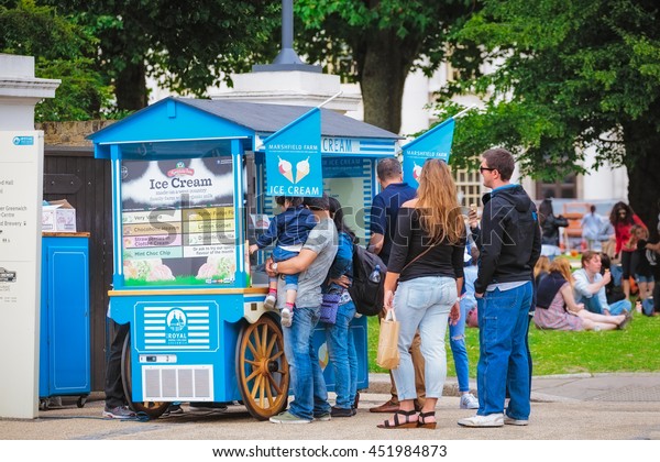 LONDON, ENGLAND
- May 14, 2016 : People buying ice creams in Greenwich Park in 
England. London is the capital and most populous city of England,
Britain, and the United
Kingdom.