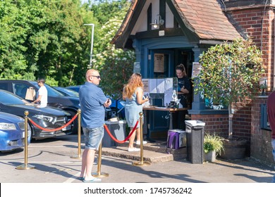 LONDON, ENGLAND - MAY 31, 2020: Traditional British Pub On A Summer's Day Overcoming The Coronavirus COVID-19 Pandemic Restrictions By Offering Counter Takeaway Service For Beer And Cocktails