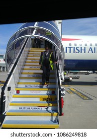 London, England - May 3,2018: British Airways Plane With Exit Stairs On Tarmac At London Heathrow Airport. 