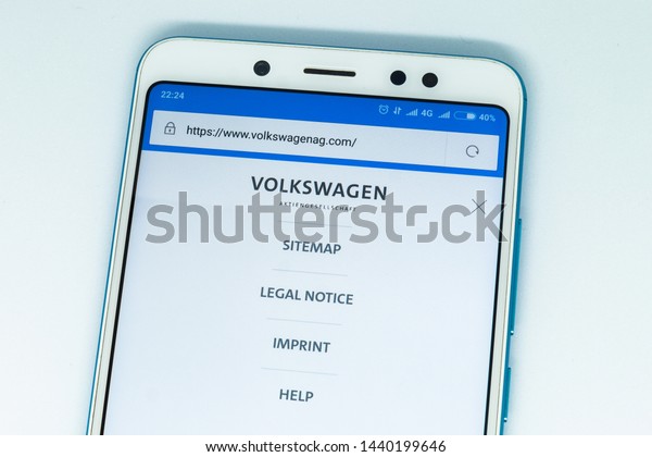 London, ENGLAND - may 9,\
2019: Logo of volkswagen.com website displayed on the screen of the\
mobile device. volkswagen logo visible on display of modern\
smartphone on white