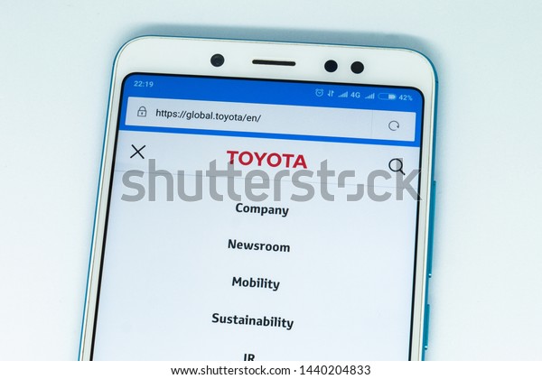 London, ENGLAND -\
may 9, 2019: Logo of toyota.com website displayed on the screen of\
the mobile device. toyota logo visible on display of modern\
smartphone on white\
background