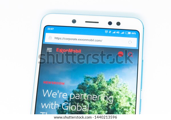 London, ENGLAND\
- may 9, 2019: Logo of exxonmobil com website displayed on the\
screen of the mobile device. exxonmobil logo visible on display of\
modern smartphone on white\
background