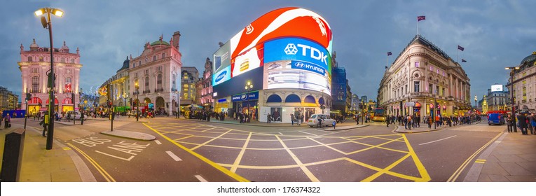 LONDON, ENGLAND NOV 28: Famous Piccadilly Circus neon signage that has become a major attraction of London on on Nov 28, 2013 in London, United Kingdom. Panorama of new Piccadilly advertisment lights