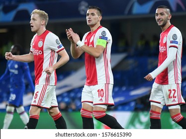 LONDON, ENGLAND - NOVEMBER 5, 2019: Donny van de Beek, Dusan Tadic and Hakim Ziyech celebrate during the 2019/20 UEFA Champions League Group H game between Chelsea FC and AFC Ajax.
