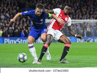 LONDON, ENGLAND - NOVEMBER 5, 2019: Cesar Azpilicueta of Chelsea and Quincy Promes of Ajax pictured during the 2019/20 UEFA Champions League Group H game between Chelsea FC and AFC Ajax.