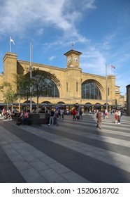 LONDON, ENGLAND - SEPTEMBER 15, 2019: People On The Square Outside Kings Cross Railway Station In London, England