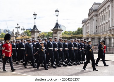 LONDON, ENGLAND - SEPTEMBER 19, 2022: Sailors Of The Royal Navy Pull The Gun Carriage Bearing Queen Elizabeth II Past Buckingham Palace On Her Funeral Day Journey To Be Laid To Rest At Windsor Castle.