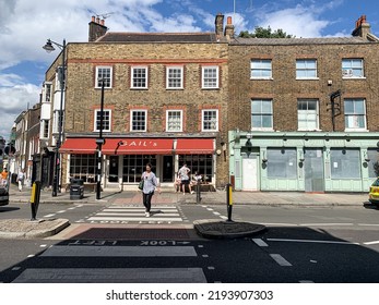 London, England, UK - 20.08.2022. Street View Of Highgate High Street. Fragment Of Facade Of Local Small Shops. North Of London. A View Down Characterful Highgate High Street. Victorian And Georgian