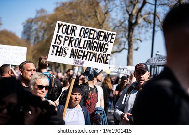 London, England, UK - April 24, 2021: Protester holds a placard at "Unite For Freedom" Protest Against Vaccine Passports Held In London Credit: Loredana Sangiuliano