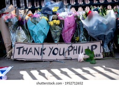 London, England, UK - April 9, 2021: Laying of flowers tribute for Prince Philip, Duke of Edinburgh, at Buckingham Palace gate Credit: Loredana Sangiuliano