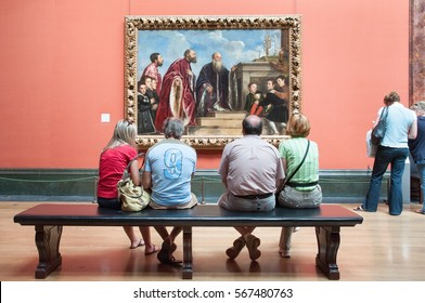 LONDON, ENGLAND, UK - MAY 30, 2009: Visitors Looking At The Vendramin Family Painting By Titian In The National Gallery, London, England, UK