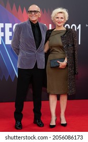 London, England, UK - October 11, 2021: Producer Roger Frappier and Caroline Dumas attend “The Power of the Dog” UK Premiere, 65th BFI London Film Festival at The Royal Festival Hall