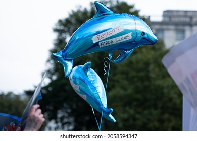 London, England, UK - October 16, 2021: Activists hold signs and dolphin balloons at the Stop the Whale and Dolphin Slaughter Protest at Trafalgar Square. Credit: Loredana Sangiuliano