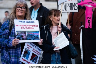 London, England, UK - October 16, 2021: Protesters hold signs at Stop the Whale and Dolphin Slaughter Protest at Trafalgar Square. Credit: Loredana Sangiuliano