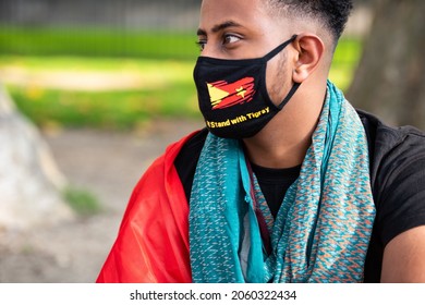 London, England, UK - October 19, 2021: A protester wears a face mask voicing their opinion at the Tigray Genocide Protest outside 10 Downing Street. Credit: Loredana Sangiuliano