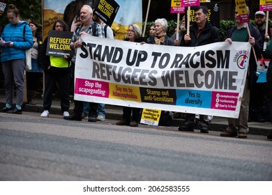 London, England, UK - October 23, 2021: Protesters hold placards at the Defend the Right to Asylum! protest. Credit: Loredana Sangiuliano