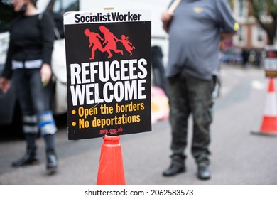 London, England, UK - October 23, 2021: Protesters hold placards at the Defend the Right to Asylum! protest. Credit: Loredana Sangiuliano