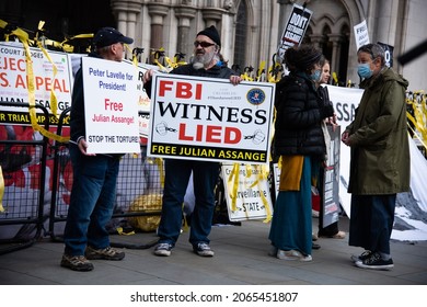 London, England, UK - October 28, 2021: Activists hold signs at the Free Assange Protest at the Royal Courts of Justice. Credit: Loredana Sangiuliano