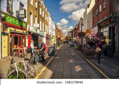London, England, UK - September 18, 2011: Sun shines on the independent shops and cafes of Exmouth Market in central London.