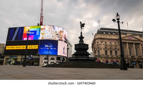 London, England / United Kingdom - April 8 2020: View Of Picadilly Circus Empty Due To Coronavirus Outbreak