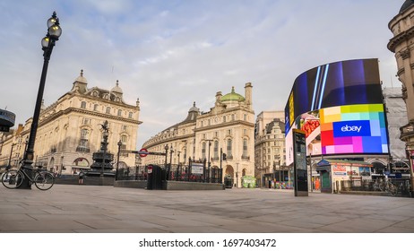 London, England / United Kingdom - April 8 2020: View Of Picadilly Circus Empty Due To Coronavirus Outbreak