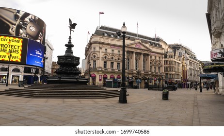 London, England / United Kingdom - April 8 2020: View Of Picadilly Circus Empty Due To Coronavirus Outbreak