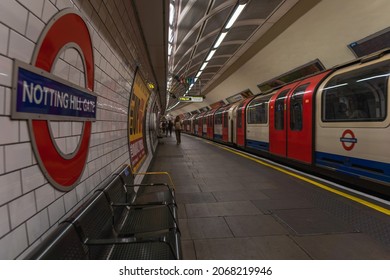 London, England, United Kingdom - November 2021: Notting Hill Gate London Underground Tube Station. Tube Train On Right Side Of Frame. Wide Angle Short Of London Underground Station. London Transport